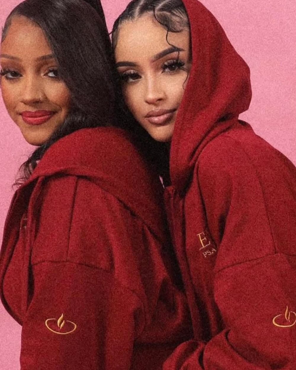 Two women in the AEVAH burgundy hoodie sets